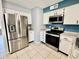Kitchen with stainless steel appliances, white cabinets and granite countertops at 8402 N 105Th Ln, Peoria, AZ 85345