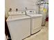 This laundry room includes washer, dryer, and water heater at 8402 N 105Th Ln, Peoria, AZ 85345