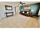 Inviting living room with tile floors, neutral paint, and a cozy seating area at 8402 N 105Th Ln, Peoria, AZ 85345