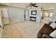 Open living room with tile flooring, neutral walls, and access to backyard patio at 8402 N 105Th Ln, Peoria, AZ 85345