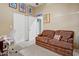Bedroom with neutral walls, carpet floors, closet, and cozy couch for relaxing or reading at 8526 E Hackamore Dr, Scottsdale, AZ 85255