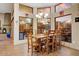 Dining room area with large windows, a fireplace, and a chandelier at 8526 E Hackamore Dr, Scottsdale, AZ 85255