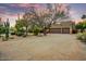 Exterior of home with desert landscaping, complemented by a spacious driveway and a two-car garage at 8526 E Hackamore Dr, Scottsdale, AZ 85255