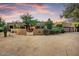 Charming home with desert landscaping, showcasing a welcoming facade and a two-car garage at 8526 E Hackamore Dr, Scottsdale, AZ 85255