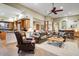 Open concept living room with comfortable seating, bar area, and easy access to the kitchen at 8526 E Hackamore Dr, Scottsdale, AZ 85255
