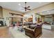 Spacious living room with comfortable seating, fireplace, and access to the outdoor area through glass doors at 8526 E Hackamore Dr, Scottsdale, AZ 85255