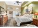 Spacious main bedroom features a ceiling fan, an en suite bath, and lots of natural light at 8526 E Hackamore Dr, Scottsdale, AZ 85255