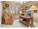 Office space is naturally lit and features a wooden desk, an armchair, and carpeting at 8526 E Hackamore Dr, Scottsdale, AZ 85255