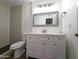 Bathroom with modern vanity, subway tile, walk-in shower, and contrasting black floor at 8558 E Indian School Rd # A, Scottsdale, AZ 85251