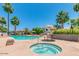 Resort-style pool and jacuzzi area with palm trees and lounge seating offers relaxation and recreation at 8558 E Indian School Rd # A, Scottsdale, AZ 85251