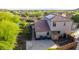 Aerial view showcasing the backyard with solar panels, landscaping, and a patio for outdoor living at 9231 W Bent Tree Dr, Peoria, AZ 85383