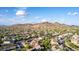 Breathtaking aerial view of a vast suburban community with mountains and sprawling desert landscape as backdrop at 9231 W Bent Tree Dr, Peoria, AZ 85383