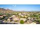 Panoramic aerial shot capturing the neighborhood, mountains, and lush desert landscaping in a beautiful setting at 9231 W Bent Tree Dr, Peoria, AZ 85383