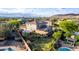Aerial view of a backyard featuring a pool, deck, patio, and a well-maintained lawn with desert landscaping at 9231 W Bent Tree Dr, Peoria, AZ 85383