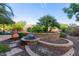 Beautiful fountain and professional landscaping, enhancing the serene backyard ambiance at 9231 W Bent Tree Dr, Peoria, AZ 85383