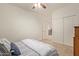 Comfortable bedroom with plush carpet, and sliding closet doors at 9231 W Bent Tree Dr, Peoria, AZ 85383