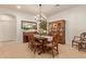 Formal dining room with traditional wood furniture, a chandelier, and stylish decor at 9231 W Bent Tree Dr, Peoria, AZ 85383