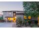 Inviting two-story home featuring a charming front porch, desert landscaping, and a warm, welcoming ambiance at 9231 W Bent Tree Dr, Peoria, AZ 85383