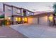 Attractive home with a three-car garage, desert landscaping, and a welcoming front porch at 9231 W Bent Tree Dr, Peoria, AZ 85383