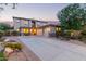 Spacious home with a three-car garage, desert landscaping, and a welcoming front porch at 9231 W Bent Tree Dr, Peoria, AZ 85383
