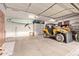 Spacious garage with ample storage cabinets and room for recreational vehicles and equipment at 9231 W Bent Tree Dr, Peoria, AZ 85383