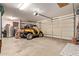 Garage featuring a large door, space for recreational vehicles and ample storage at 9231 W Bent Tree Dr, Peoria, AZ 85383