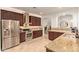 Gourmet kitchen with stainless steel appliances, granite counters and rich cabinetry at 9231 W Bent Tree Dr, Peoria, AZ 85383