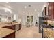 Bright kitchen features granite counters, stainless steel appliances, and a seamless flow into the adjacent dining area at 9231 W Bent Tree Dr, Peoria, AZ 85383
