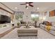 Spacious living room featuring a decorative brick feature and modern finishes at 9231 W Bent Tree Dr, Peoria, AZ 85383