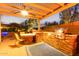 Backyard kitchen with a barbecue and stone countertop at 9231 W Bent Tree Dr, Peoria, AZ 85383