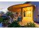Charming outdoor patio with comfortable seating, brick pavers, and lush greenery for a serene outdoor living space at 9231 W Bent Tree Dr, Peoria, AZ 85383