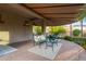 Covered outdoor patio featuring comfortable seating and shade, perfect for relaxation at 9231 W Bent Tree Dr, Peoria, AZ 85383