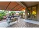 Outdoor patio showcasing comfortable seating, lush landscaping, and convenient access to the home at 9231 W Bent Tree Dr, Peoria, AZ 85383