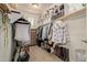 Large walk-in closet with built in shelves and hanging racks for a lot of storage at 9231 W Bent Tree Dr, Peoria, AZ 85383