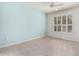 Light-filled bedroom with a ceiling fan, hardwood floors, and a serene color scheme at 9550 E Thunderbird Rd # 259, Scottsdale, AZ 85260