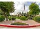 A community gathering area with an American flag, landscaping and flowering plants at 9550 E Thunderbird Rd # 259, Scottsdale, AZ 85260