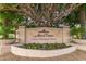 The entrance sign of Mira Vista Luxury Condominium Homes with seasonal flowers at 9550 E Thunderbird Rd # 259, Scottsdale, AZ 85260