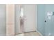 Light and bright foyer with white front door and modern tile flooring at 9550 E Thunderbird Rd # 259, Scottsdale, AZ 85260