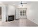 Cozy living room with hardwood floors, fireplace, white cabinets, and bright windows at 9550 E Thunderbird Rd # 259, Scottsdale, AZ 85260