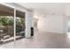 Spacious living room with patio access, fireplace, and ceiling fan offering comfort at 9550 E Thunderbird Rd # 259, Scottsdale, AZ 85260