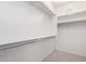 Neat and spacious walk-in closet with metal racks at 9550 E Thunderbird Rd # 259, Scottsdale, AZ 85260