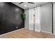 Cozy bedroom with a statement wall, hardwood floors, and natural light at 9570 W Whispering Wind Dr, Peoria, AZ 85383