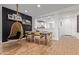 Dining area with modern decor including a wooden table and a hanging swing chair at 9570 W Whispering Wind Dr, Peoria, AZ 85383