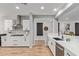 Bright kitchen with white cabinets, stainless steel appliances, and an eat-at counter at 9570 W Whispering Wind Dr, Peoria, AZ 85383