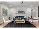 Beautiful living room featuring a blue sofa, a wooden coffee table and modern decor at 9570 W Whispering Wind Dr, Peoria, AZ 85383