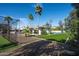 A private lounge, backyard sports court and the main house are all part of the backyard's allure at 9733 E Clinton St, Scottsdale, AZ 85260