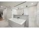 Bathroom featuring a soaking tub, walk-in shower, modern fixtures, and neutral tiling at 9733 E Clinton St, Scottsdale, AZ 85260