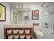 Bright bathroom with double sink vanity with storage and bathtub with shower at 9733 E Clinton St, Scottsdale, AZ 85260