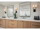 Bathroom showcasing double vanities, modern fixtures, and a glimpse into the shower at 9733 E Clinton St, Scottsdale, AZ 85260