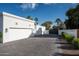 A long driveway leads to the attached two car garage of this attractive modern home at 9733 E Clinton St, Scottsdale, AZ 85260